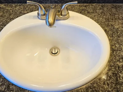 White sink with silver faucet